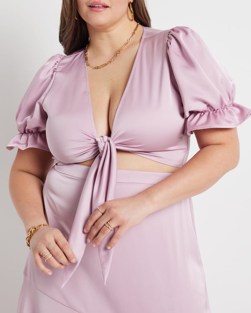 Front of a model wearing a size 14 Kelsey Satin Cropped Blouse in Dawn Pink by ELOQUII. | dia_product_style_image_id:216994